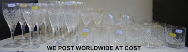A suite of Edinburgh crystal glasses to include champagne flutes, brandy balloons,