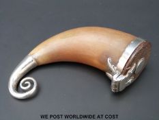 A horn white metal mounted Scottish snuff mull with scrolling tailpiece,