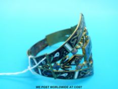 A brass bracelet, believed to be Egyptian revival,