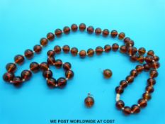 An amber bead necklace and earrings
