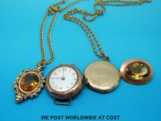 A 9ct gold ladies watch, yellow metal pendant, yellow metal brooch marked 9ct gold set with citrine,
