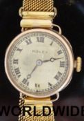 Rolex 9ct gold ladies wristwatch with black hands and Roman numerals, on mesh link strap,