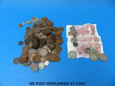 A quantity of mixed coinage, Victoria onwards including some silver, ten shilling notes etc.