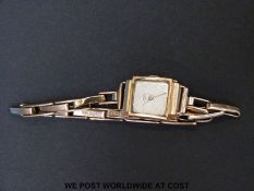 Ancre 18ct gold ladies wristwatch with gold hands and markers on expanding bracelet,