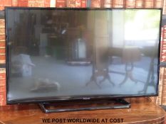 A Panasonic flat screen television and accessories