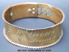 A heavy Georgian/Victorian brass dog collar with three slot and loop adjustment,