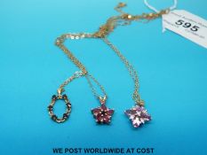 Three 9ct gold chains and three 9ct gold pendants, one set with sapphires,