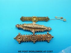 Three 15ct gold brooches with filigree decoration