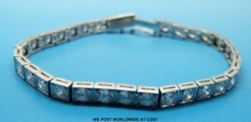 An 18ct white gold bracelet set with 32 round brilliant cut diamonds each approximately 0.