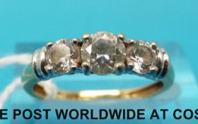 An 18ct gold ring set with three cubic zirconia (size M)