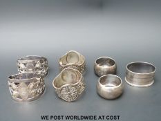 Three pairs of hallmarked silver napkin rings to include Walker & Hall and Iona Celtic design,