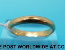 A yellow metal wedding band (size P, 4.
