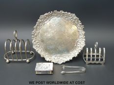 A hallmarked silver toast rack (61g), a silver match box holder,
