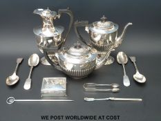 A hallmarked silver cigarette box, silver sugar tongs,