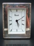 An hallmarked silver framed Harrods desk clock