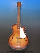 A steel strung cello cut away guitar by Egmond