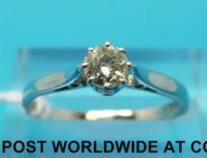 An 18ct white gold ring set with a round brilliant cut diamond (size O)