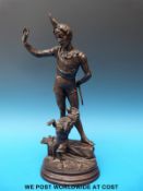 A bronze figure of a boy training his dog to jump through a hoop, impressed verso A Barye.