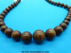 A necklace made up of graduating spherical sun stone beads