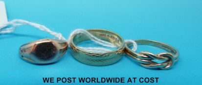 Three 9ct gold rings including gold signet ring and another in the form of a knot