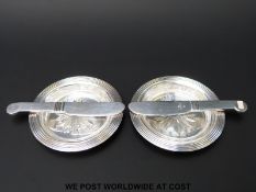 A pair of Christofle butter dishes and knives with Baccarat glass liners