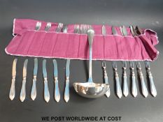A set of hallmarked silver handled dessert forks/knives together with a plated ladle and a set of