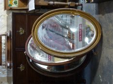 Three oval mirrors with bevelled glass
