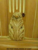 An oval pine table raised on a central carved column (max diameter 130 x H76cm)