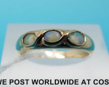 A 9ct gold ring set with three opals (size N)