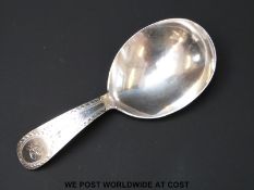 A Georgian hallmarked silver caddy spoon with bright cut handle, Ldn 1794 makers mark WS,