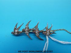 A Victorian brooch in the form of swallows set with diamonds and with ruby eyes