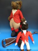 Three toy foxes in hunting pink,