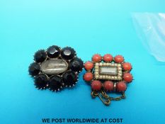 Two Victorian yellow metal mourning brooches set with hair to the centre,