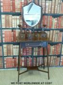 Early 20thC inlaid mahogany dressing table with fitted shield shaped mirror fitted with an