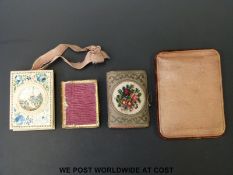 Four 19thC book themed pin cushions including a hand decorated bone example,