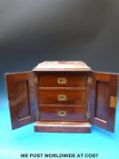 A small walnut apprentice or collectors cabinet opening to reveal three drawers (H36 x W28 x D20cm)