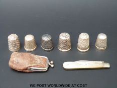 Six hallmarked silver thimbles to including two by Charles Horner and a hallmarked silver pen knife