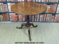 A 19thC mahogany circular table with birdcage mechanism raised on a tripod base (H69 x D75cm)