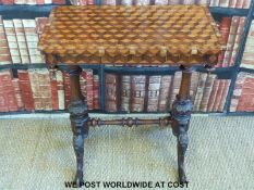 A 19thC parquetry inlaid table on carved scrolling legs (H70 x L68 x W40.