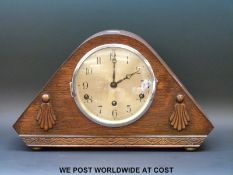 An oak cased mid 1930's Art Deco mantel clock, the dual chime/silent facility striking on chimes,