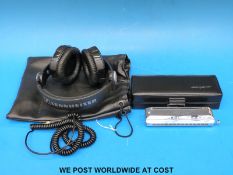 A cased Hohner Meisterkiasse 7565 harmonica in key of C with 12 holes, fully chromatic,