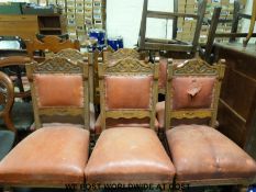 A set of six 19thC upholstered carved oak chairs