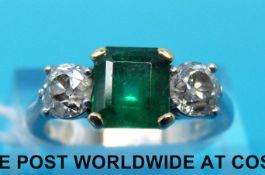 A platinum ring set with an asscher cut emerald measuring approx 1.