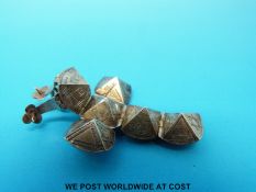 A yellow metal Masonic charm