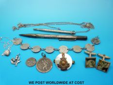 A quantity of silver jewellery to include a coin bracelet, silver pencil,