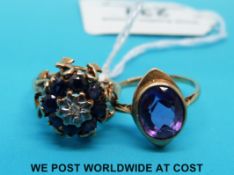 A 9ct gold ring set with a diamond surrounded by sapphires,