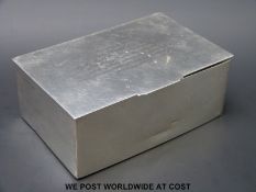 A hallmarked silver cigarette box (width 14.