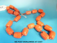 Two necklaces, one coral coloured ceramic beads,