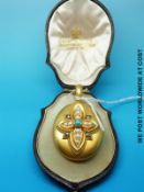 A Victorian mourning locket marked 15ct set with a central turquoise,