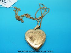 A yellow metal heart locket marked 22ct (13.